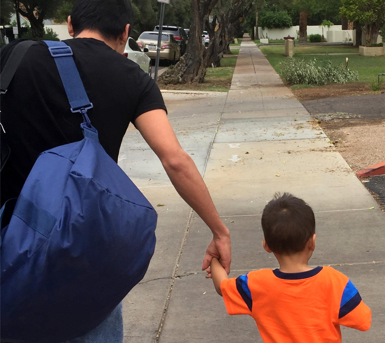 Jose A. and his 3-year-old son were reunited after being separated by border officials at the Hidalgo Port of Entry in Texas in May. (Photo: Gracie Willis/Southern Poverty Law Center)