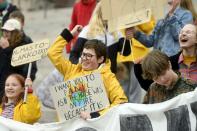 Young climate activists demonstrate in front of the Finnish Parliament building in Helsinki, Finland, Friday May 24, 2019, a global day of student protests aiming to spark world leaders into action on climate change. (Vesa Moilanen/Lehtikuva via AP)