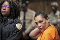 Sherra Wright listens as prosecutor Paul Hagerman reads a list of evidence against her during a hearing in Judge Lee Coffee's court in Memphis, Tenn., on Thursday, July 25, 2019, where Wright plead guilty to the first degree murder of her husband, former Grizzlies player Lorenzen Wright. (Jim Weber/Daily Memphian via AP)