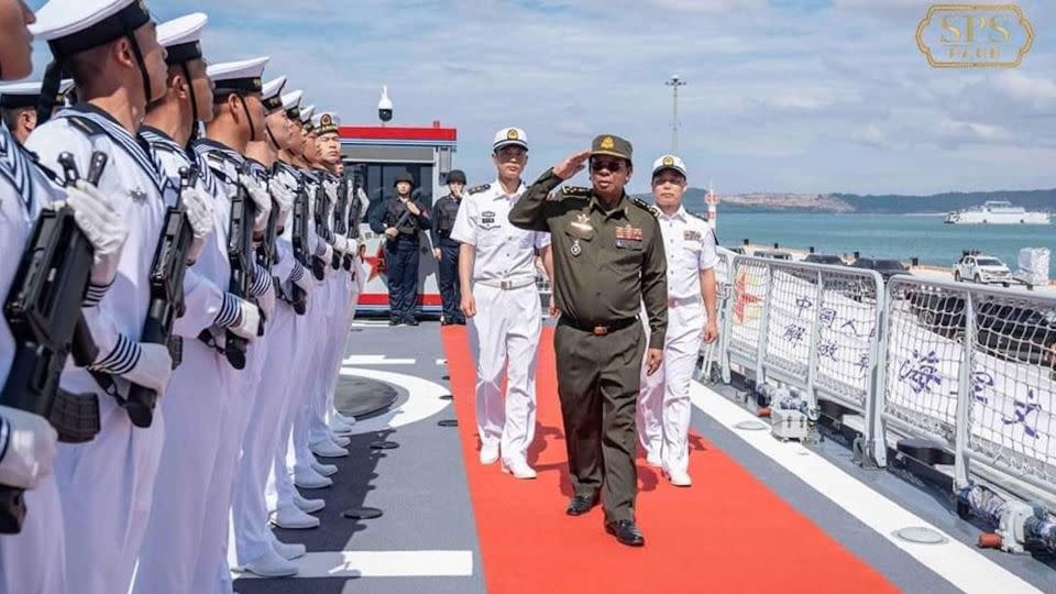 Tea Banh, former Cambodian Defense Minister, reviews Chinese naval officers on board a Chinese corvette at the Ream Naval Base. - Cambodia Defense Minister