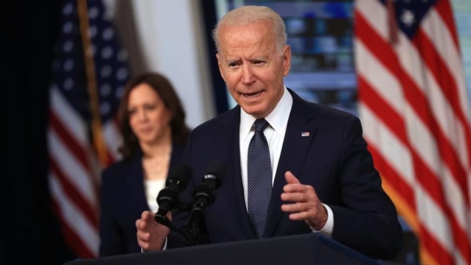 President Joe Biden delivers remarks at the White House as Vice President Kamala Harris watches on July 15, 2021, the day tens of millions of parents got their first monthly child tax credit relief payments. The credit was temporarily increased during the pandemic and helped lower poverty rates. (Photo: Chip Somodevilla/Getty Images)