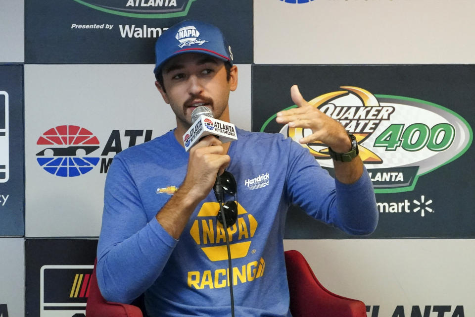 Driver Chase Elliott speaks to the media during a weather delay before qualifying the NASCAR Cup Series auto race at Atlanta Motor Speedway in Hampton, Ga., on Saturday, July 9, 2022. (AP Photo/Bob Andres)