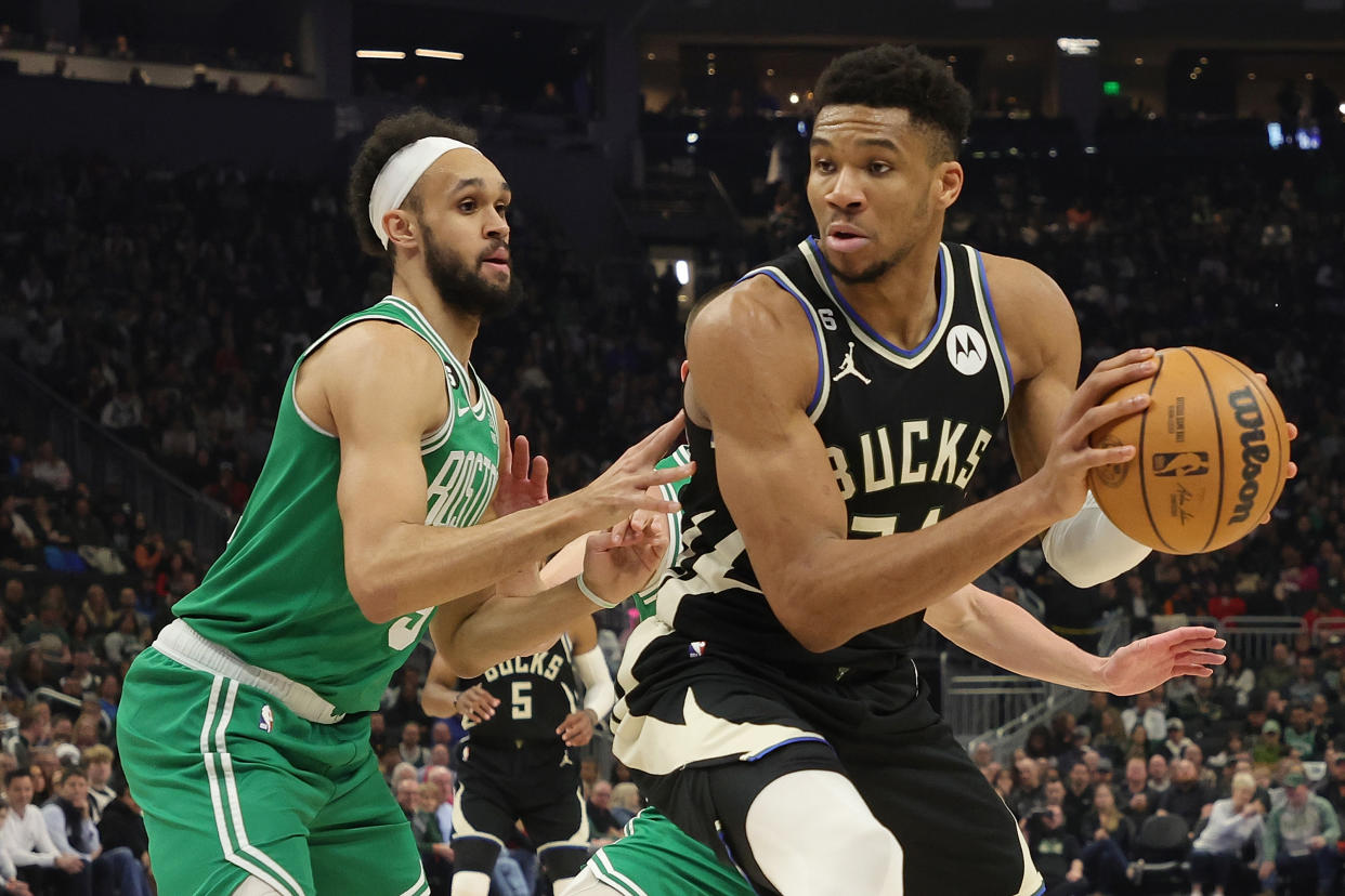 MILWAUKEE, WISCONSIN - FEBRUARY 14: Giannis Antetokounmpo #34 of the Milwaukee Bucks is defended by Derrick White #9 of the Boston Celtics during a game at Fiserv Forum on February 14, 2023 in Milwaukee, Wisconsin. The Bucks defeated the Celtics 131-125 in overtime. NOTE TO USER: User expressly acknowledges and agrees that, by downloading and or using this photograph, User is consenting to the terms and conditions of the Getty Images License Agreement. (Photo by Stacy Revere/Getty Images)