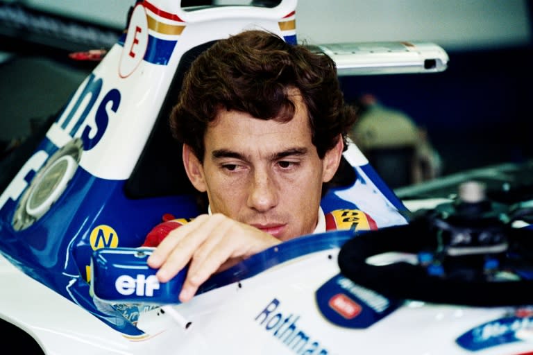 Ayrton Senna adjusts his mirror in the pits at Imola ahead of his last race (JEAN-LOUP GAUTREAU)