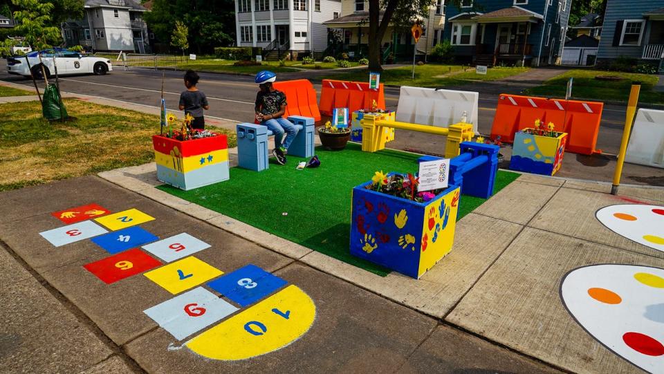 In June, Reconnect Rochester gathered neighbors and community advocates to install traffic calming measures like curb bump outs and street murals at the intersection of Arnett Boulevard and Warwick Avenue in Rochester's 19th Ward.