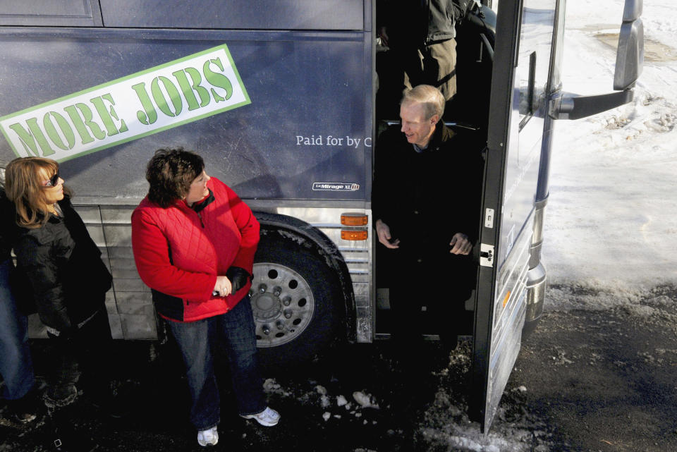 FILE - In this Jan. 7, 2014 file photo, venture capitalist Bruce Rauner, a candidate for the Republican nomination for Illinois governor, is greeted by supporters as he steps off his charter bus for a campaign stop in Carbondale, Ill. Rauner, who made his fortune as a venture capitalist, is new to campaigning and brags of being beholden to no one. He is considered the heavy favorite in the four-way GOP primary. (AP Photo/The Southern, Steve Matzker, File)