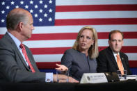 U.S. Secretary of Homeland Security Kirstjen Nielsen gestures towards U.S. Rep. Dan Donovan (R-NY) as she sits between Donovan and Rep. Lee Zeldin (R-NY) during a roundtable on immigration and the gang MS-13 with U.S. President Donald Trump at the Morrelly Homeland Security Center in Bethpage, New York, U.S., May 23, 2018. REUTERS/Kevin Lamarque