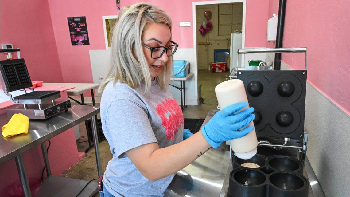 Maria Silva squeezes batter into molds to make explicit pancakes in the shapes of breasts, penises and vulvas at her new shop Cum With Me 559 in Fresno’s Tower District on Tuesday, July 18, 2023.