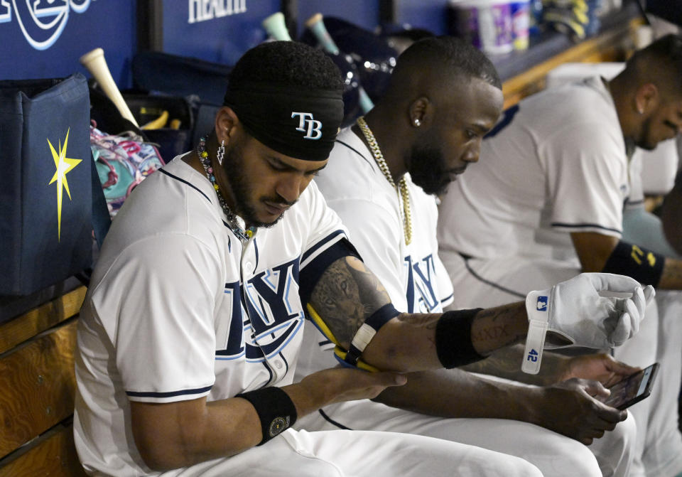 Tampa Bay Rays' Jose Siri, left, gets ready to bat during the fifth inning of a baseball game against the Los Angeles Angels Monday, April 15, 2024, in St. Petersburg, Fla. (AP Photo/Steve Nesius)