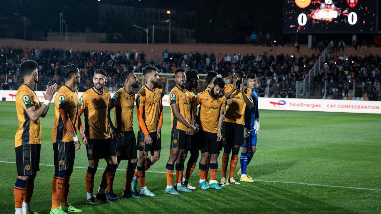 RS Berkane stand on the pitch as they wait for the USM Alger team before the second leg of their Caf Confederation Cup football semi-final match