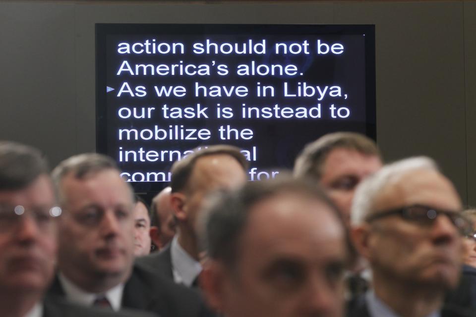 Audience members listen as President Barack Obama speaks about Libya at the National Defense University in Washington on March 28, 2011. (Photo: Charles Dharapak/AP)