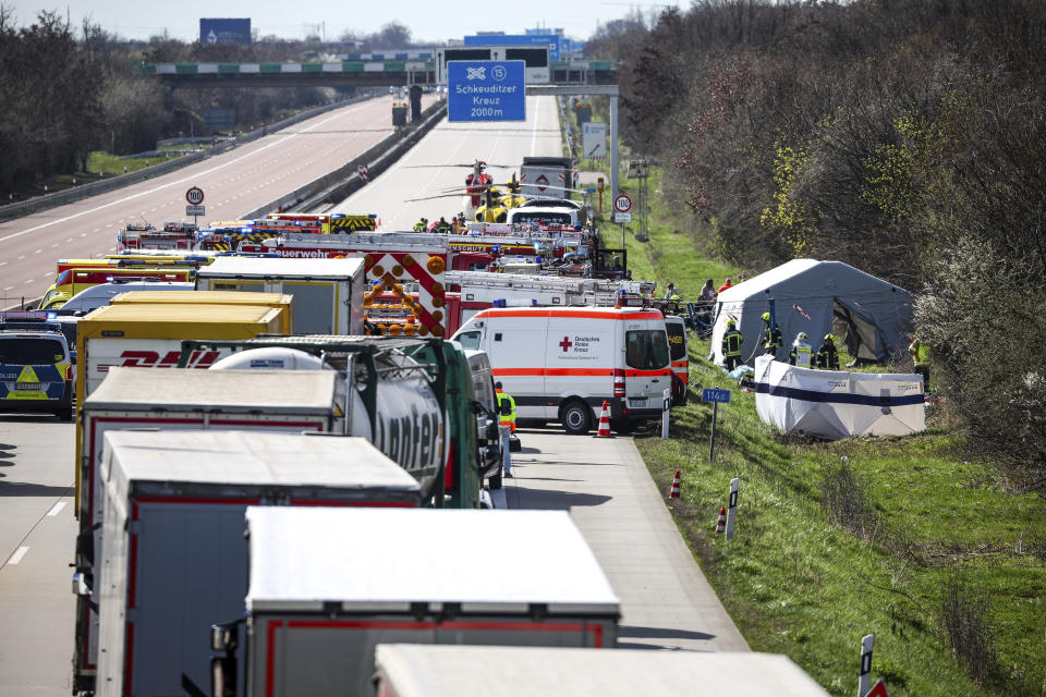 Emergency vehicles and rescue helicopters are at the scene of the accident on the A9, near Schkeuditz, Germany, Wednesday March 27. 2024. (Jan Woitas/dpa via AP)