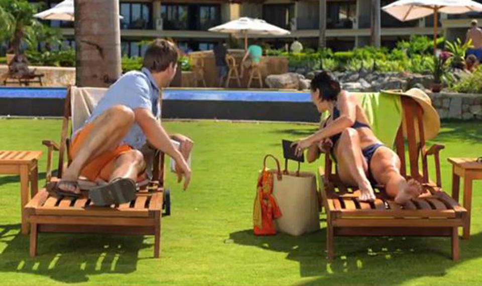 This image from video shows an image from a Kindle Paperwhite commercial featuring a young woman on a beach vacation lounging next to a young man, waiting for their husbands, shown in the background at the bar. Welcome to the latest in gay imagery in mainstream advertising, where LGBT people have been waiting for a larger helping of fairness and accuracy, on screen and in print. Traditionally lagging behind TV and film content in terms of LGBT inclusion, advertisers in this country are suffering considerably less blowback for the effort. (AP Photo/Amazon)