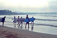 <p><span>Catch a wave on Sri Lanka's beautiful south coast, before stretching your body and mind on a yoga mat as the sun sets. <a rel="nofollow noopener" href="http://soulandsurf.com" target="_blank" data-ylk="slk:Soul and Surf;elm:context_link;itc:0;sec:content-canvas" class="link ">Soul and Surf</a> has recently opened a hotel between Galle and Weligama, and a week's stay there costs from £675pp, including a double room on a full-board basis, and all daily surf and yoga sessions. [Photo: Soul and Surf]</span> </p>