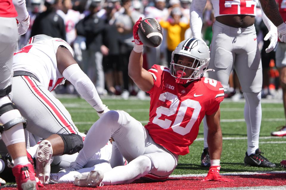 Apr 13, 2024; Columbus, OH, USA; Ohio State Buckeyes running back James Peoples (20) scores a touchdown during the Ohio State football spring game at Ohio Stadium.