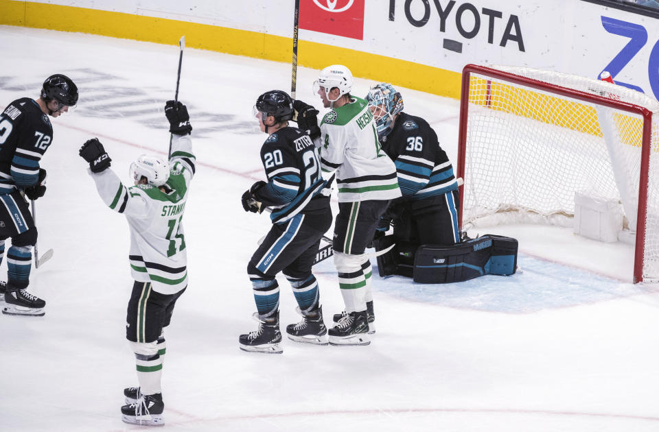 Dallas Stars center Logan Stankoven (11) celebrates his overtime goal against the San Jose Sharks during an NHL hockey game Tuesday, March 5, 2024, in San Jose, Calif. (AP Photo/Nic Coury)