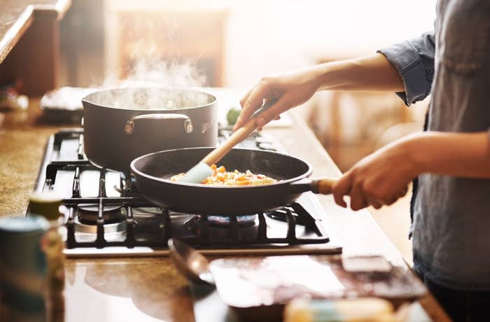 young woman preparing a meal at home