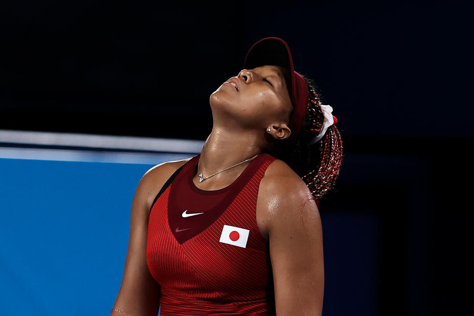 Pictured here, Japan's Naomi Osaka reacts after a point during her match against Marketa Vondrousova at the Olympics.