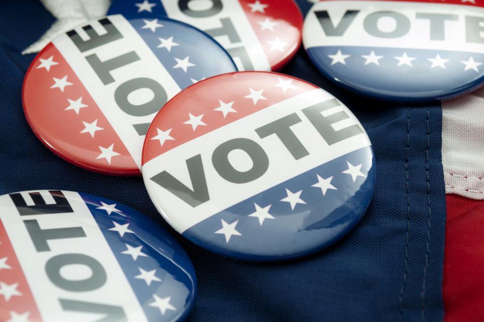 Democrat Vs Republican Poll, Democratic Decision And Primary Voting Conceptual Idea With Vote Election Campaign Button Badges And The United States Of America Flag