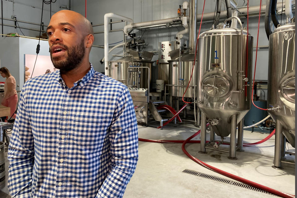 FILE - Democratic U.S. Senate candidate Mandela Barnes speaks as he tours Giant Jones Brewery, July 21, 2021, in Madison, Wis. In an interview, Barnes, a leading Democrat in the race, described the Democratic-controlled Senate as an “out-of-touch millionaire's club." He insisted he was not running against his party, although he had nothing positive to say about Biden when asked to assess the Democratic president's job performance. (AP Photo/Scott Bauer, File)