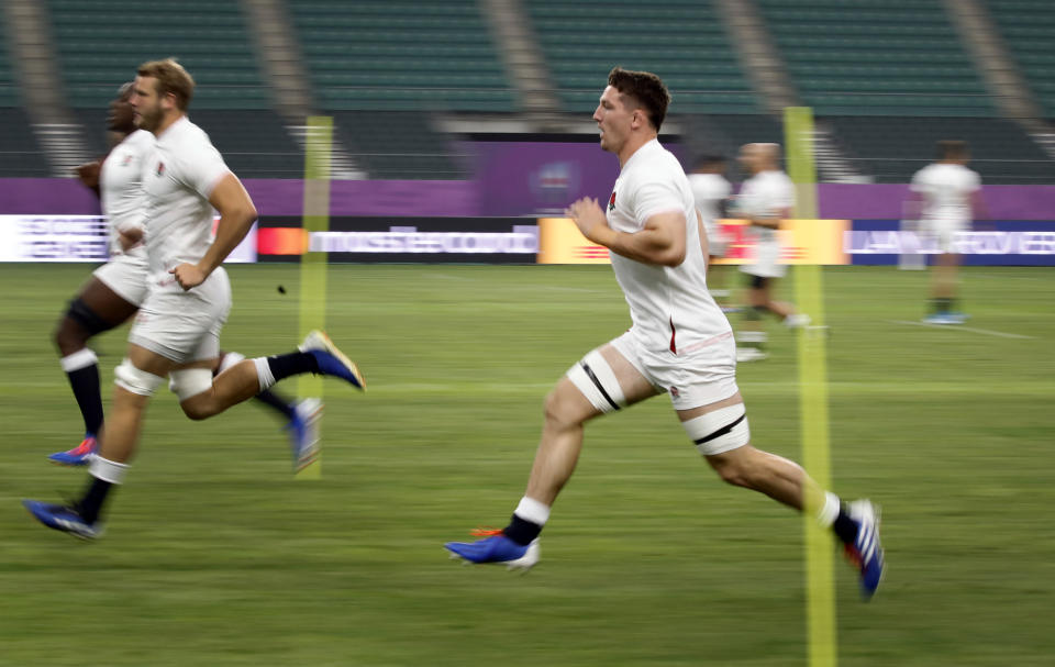 England's Tom Curry runs during a training session in Oita, Japan, Friday, Oct. 18, 2019. England will face Australia in the quarterfinals at the Rugby World Cup on Oct. 19. (AP Photo/Christophe Ena)