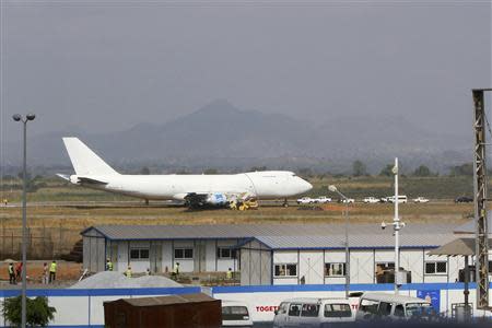 A Saudi Air Boeing 747 cargo aircraft is pictured after it overran the runway crashing into a tanker truck at the Nnamdi Azikiwe International Airport in Abuja December 5, 2013. REUTERS/Afolabi Sotunde