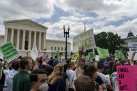 Abortion-rights protesters regroup and protest following Supreme Court's decision to overturn Roe v. Wade, federally protected right to abortion, outside the Supreme Court in Washington, Friday, June 24, 2022. The Supreme Court has ended constitutional protections for abortion that had been in place nearly 50 years, a decision by its conservative majority to overturn the court's landmark abortion cases. (AP Photo/Gemunu Amarasinghe)