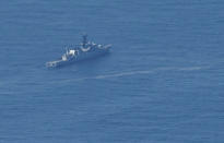 In this aerial photo taken from a maritime patrol aircraft of 800 Air Squadron of the 2nd Air Wing of Naval Aviation Center (PUSPENERBAL), an Indonesian Navy ship sails during a search for the submarine KRI Nanggala that went missing while participating in a training exercise on Wednesday in the waters off Bali Island, Indonesia, Thursday, April 22, 2021. Indonesia's navy ships on Thursday were intensely searching for the submarine that likely fell too deep to retrieve, making survival chances for all the crew on board slim. Authorities said oxygen in the submarine would run out by early Saturday. (AP Photo/Eric Ireng)