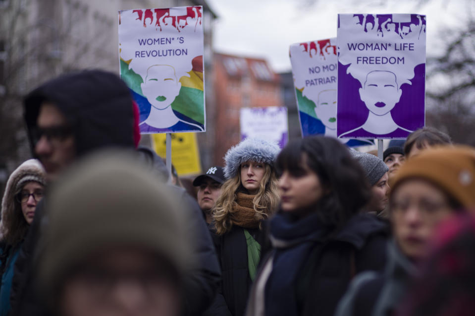 Protestors attend a rally in support to the women of Iran and Afghanistan on the International Women's Day 2023 in Berlin, Germany, Wednesday, March 8, 2023. (AP Photo/Markus Schreiber)