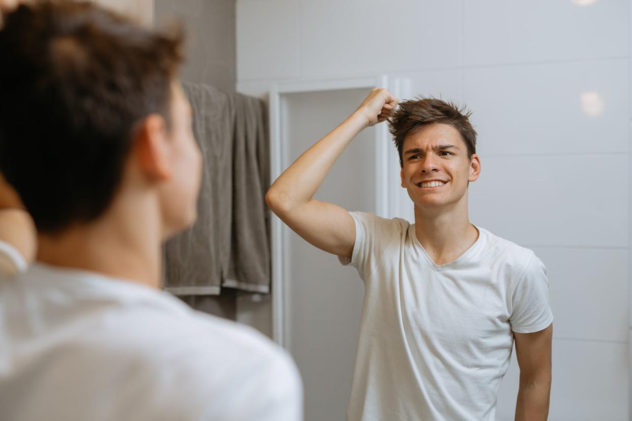 young man in bathroom. morning routine