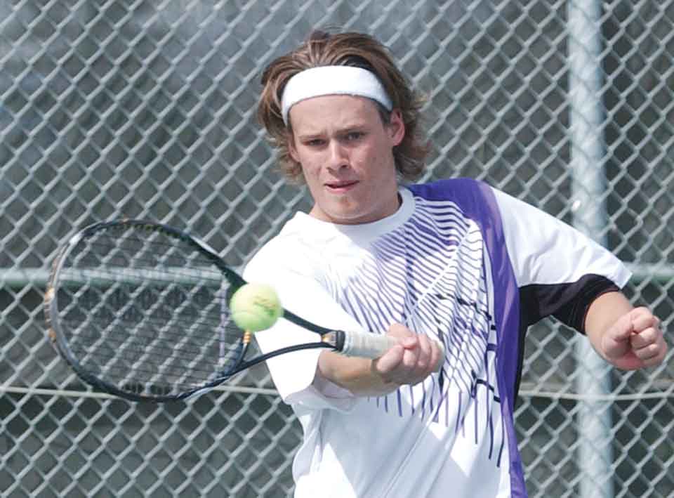 Watertown’s Mark DeSpiegler returns a shot during a No. 1 doubles match against Sioux Falls Washington in a 2014 boys tennis dual at Highland Park