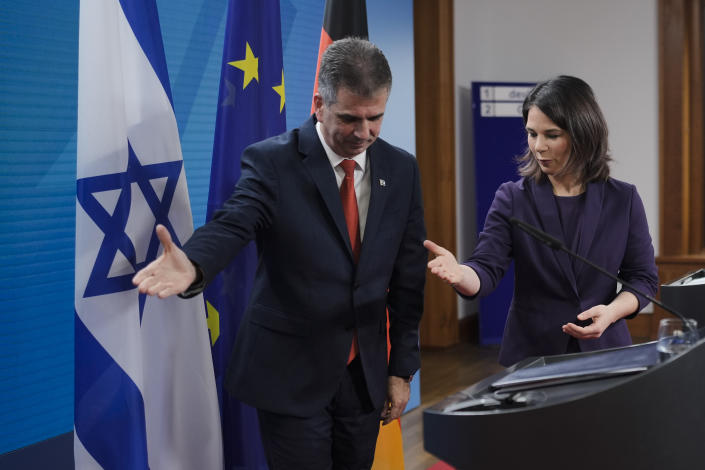 German Foreign Minister Annalena Baerbock, right, and her Israeli counterpart Eli Cohen leave a news conference after a meeting at the foreign ministry in Berlin, Germany, Tuesday, Feb. 28, 2023. (AP Photo/Markus Schreiber)