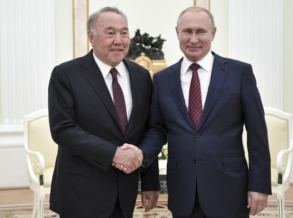 FILE In this file photo taken on Saturday, Sept. 7, 2019, Russian President Vladimir Putin, right, shakes hands with former President of Kazakhstan Nursultan Nazarbayev during their meeting in Kremlin in Moscow, Russia. Russian President Vladimir Putin prepares to mark his 20th year in power, as the longest-serving leader since Joseph Stalin. (Aleksey Nikolsky, Sputnik, Kremlin Pool Photo via AP, File)