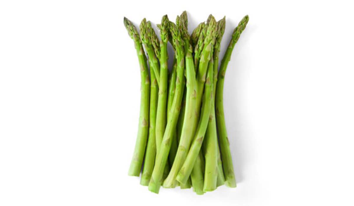 Fresh asparagus stems in a pile