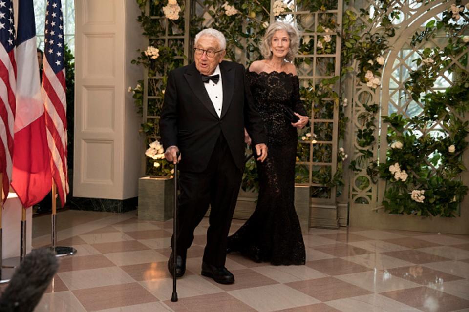 Kissinger and his wife Nancy arrive at the White House for a state dinner on 24 April 2018 (Getty)