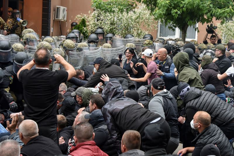 NATO Kosovo Force (KFOR) soldiers clash with local Kosovo Serb protesters in the town of Zvecan