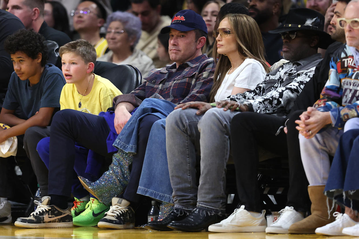 Actors Ben Affleck and Jennifer Lopez look glum in March