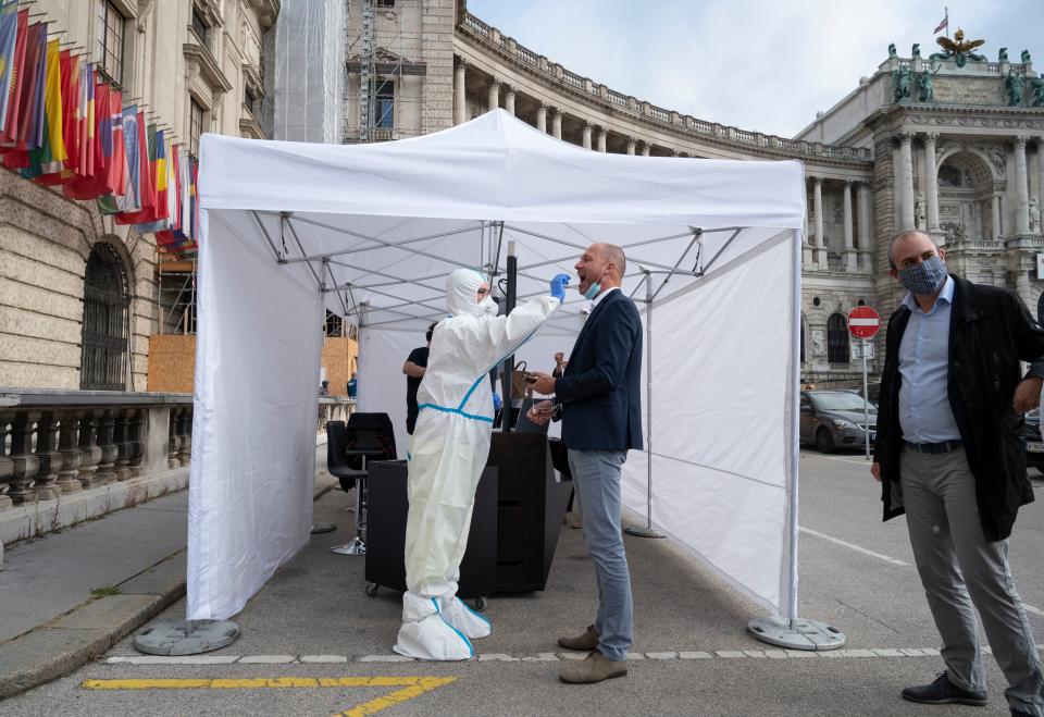 A man is tested for Covid-19 outside of the  Hofburg palace before entering an event organised by Vienna Tourism in Vienna, Austria on September 