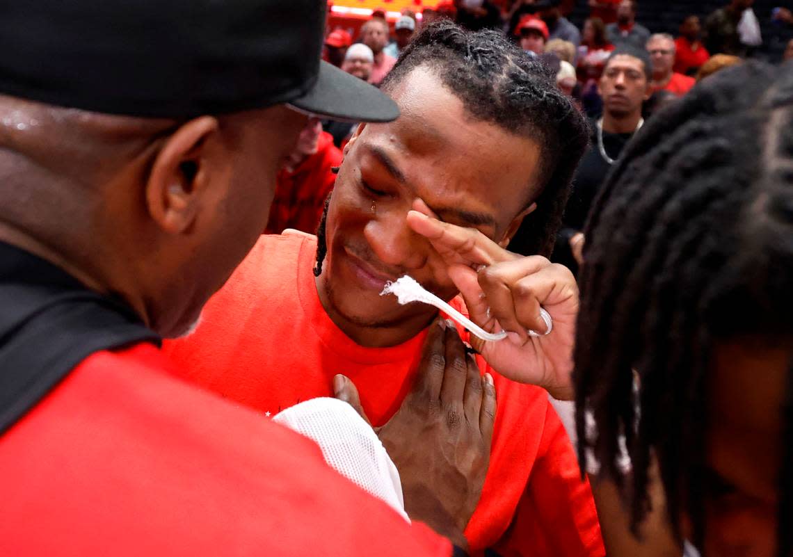 N.C. State’s DJ Horne wipes a tear from his eye after hugging his family after the Wolfpack’s 84-76 victory over UNC in the championship game of the 2024 ACC Men’s Basketball Tournament at Capital One Arena in Washington, D.C., Saturday, March 16, 2024.
