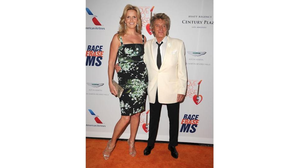 Rod Stewart and penny in florals on red carpet