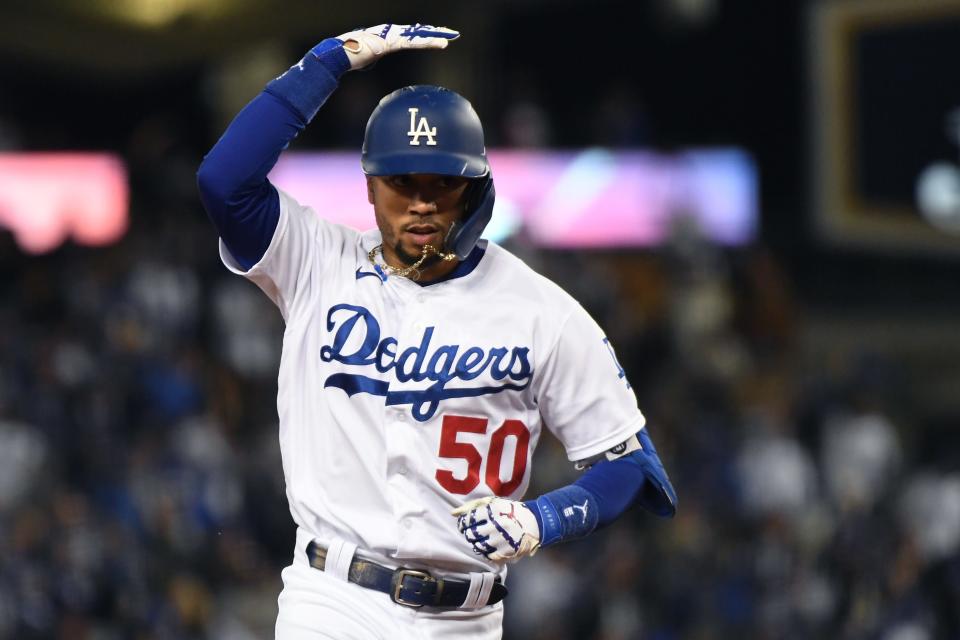 Dodgers right fielder Mookie Betts rounds the bases after hitting a two-run home run in Game 4.