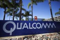 A Qualcomm sign is pictured in front of one of its many buildings in San Diego, California November 5, 2014. REUTERS/Mike Blake