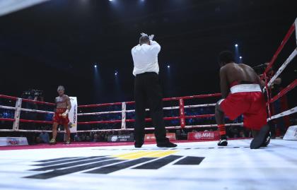 Elliot Seymour (R) struggles to get up as the referee waves off his fight with 62-year-old actor Mickey Rourke (L) in the second round Friday in Moscow. (AP Photo/Denis Tyrin)