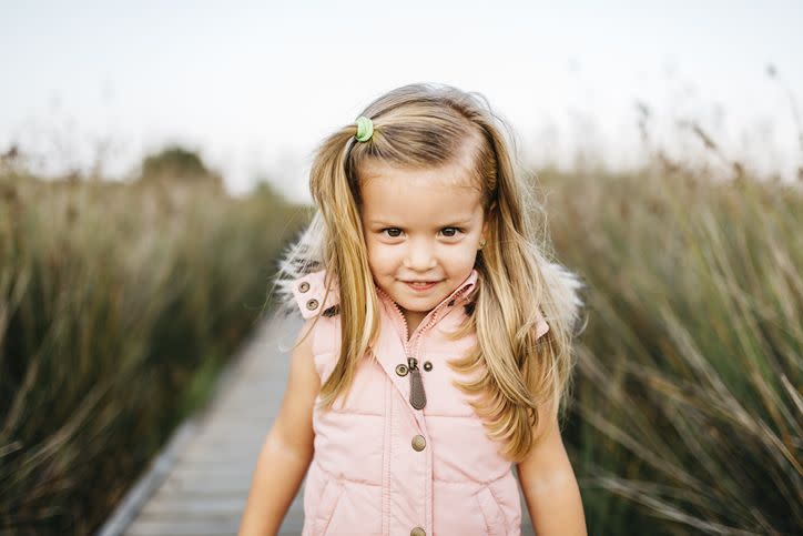 portrait of smiling little girl in nature