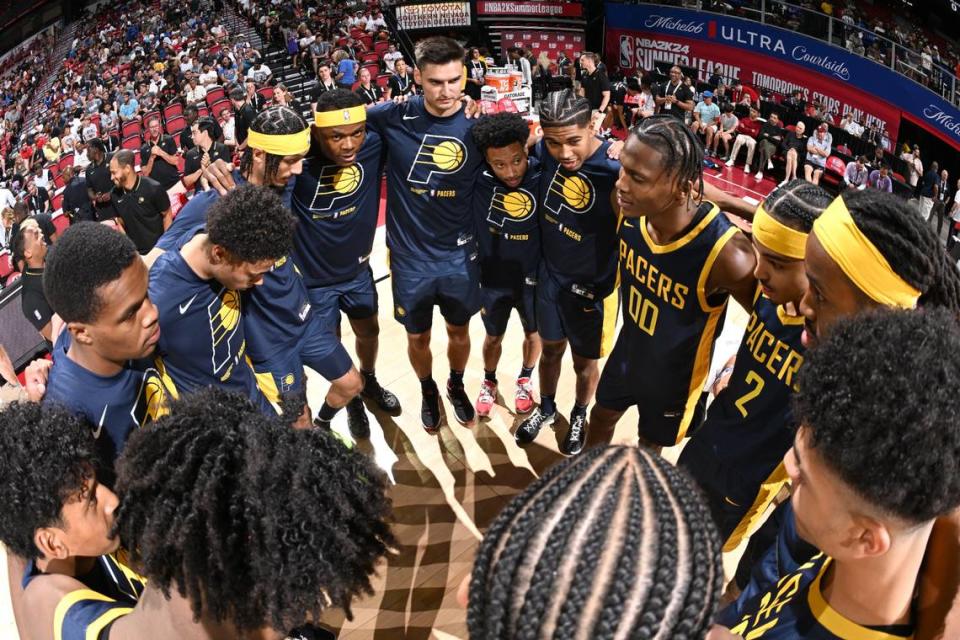 Oscar Tshiebwe, left of center in headband, contributed five points and two rebounds to Indiana’s Summer League win in his debut with the Pacers on Saturday night.