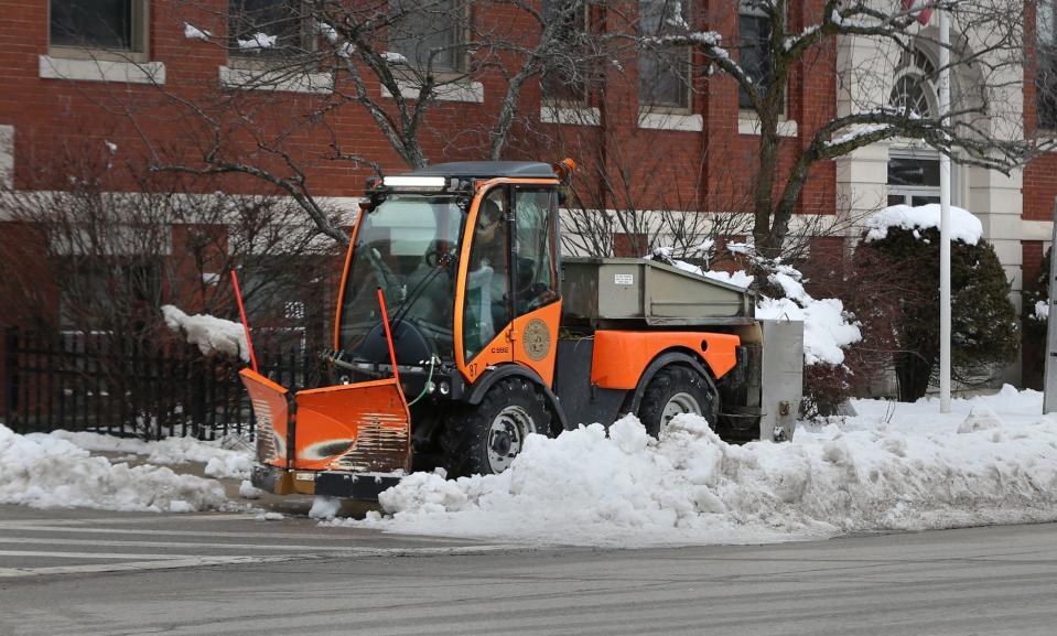 A Dover city employee operates a sidewalk plow on Central Avenue Wednesday, Jan. 25, 2023, before a new round of snow in rain was expected to arrive.