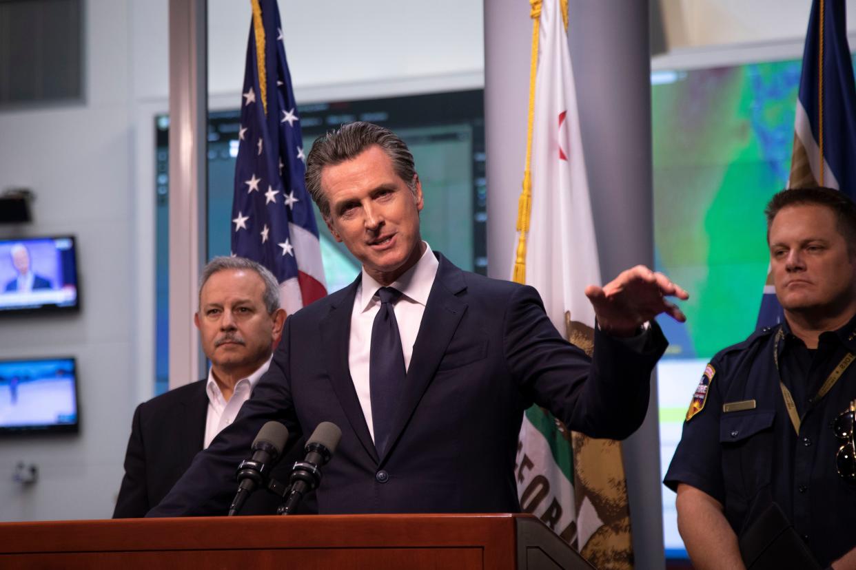 California Governor Gavin Newsom answered questions at a press conference Thursday evening, at the Office of Emergency Services outside Sacramento, Calif., about how the state would address unprecedented power outages planned by utility company PG&E