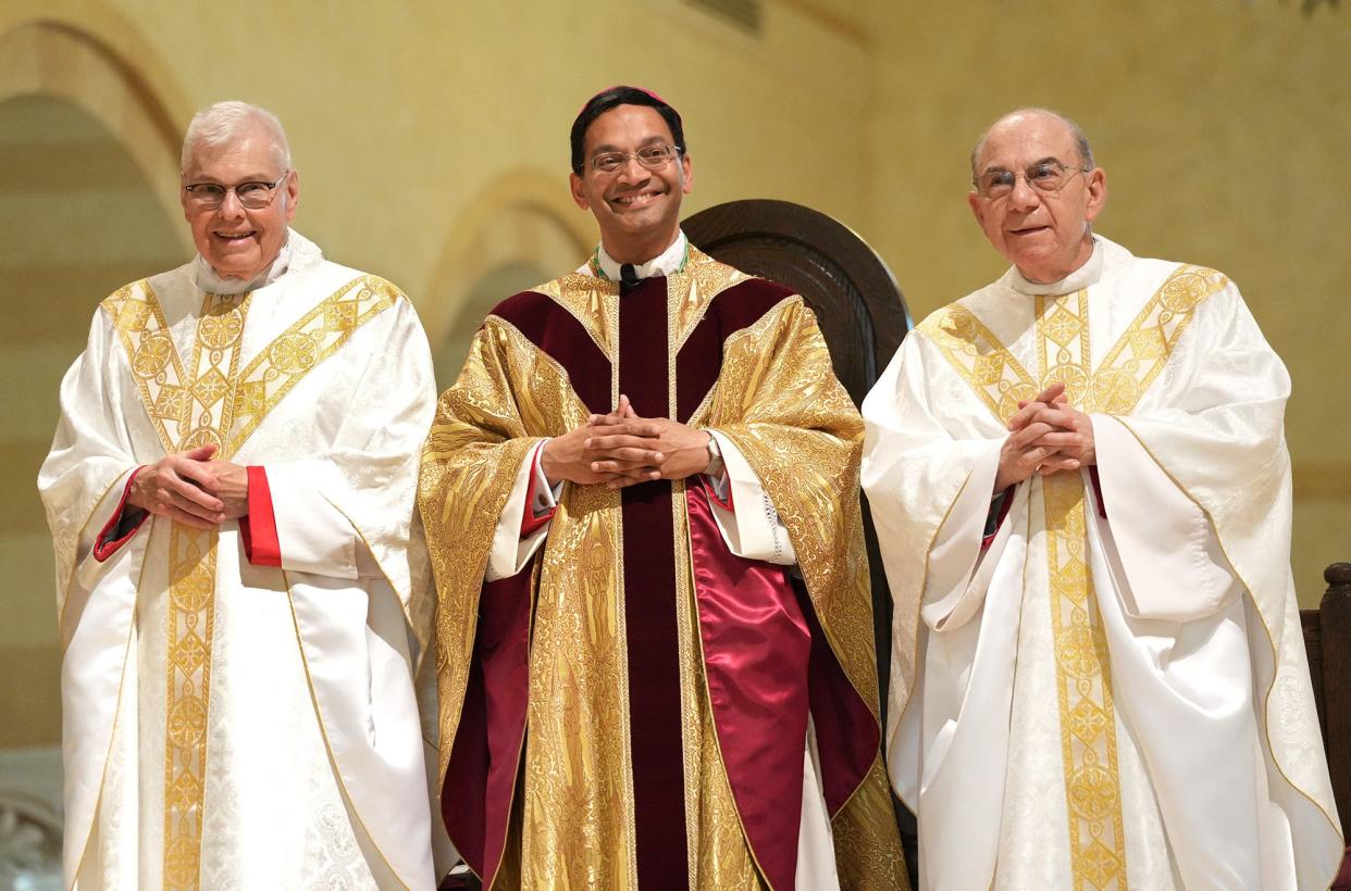 Rev. Earl K. Fernandes, center, is pictured during his ordination and installation as the thirteenth Bishop of the Diocese of Columbus at St. Paul the Apostle Church in Westerville, Ohio, on Tuesday, May 31, 2022. Fred Squillante-The Columbus Dispatch