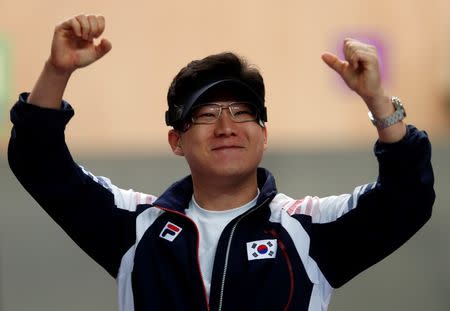 South Korea's Jin Jong-oh celebrates after winning the men's 10m air pistol final at the London 2012 Olympic Games in the Royal Artillery Barracks at Woolwich in London July 28, 2012. REUTERS/Eddie Keogh