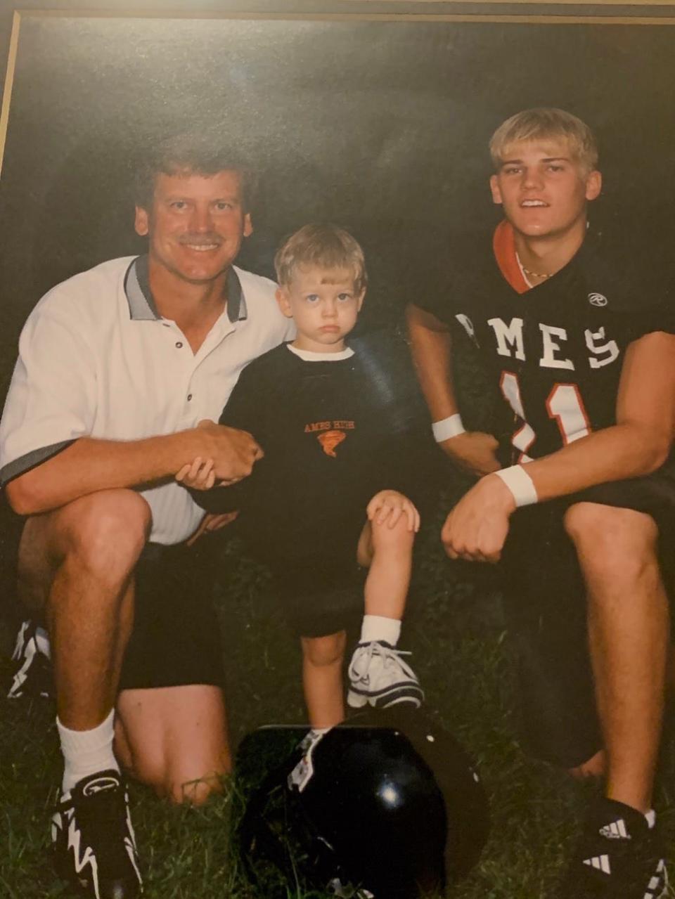 Joe Burrow (center) is looking to take Cincinnati to two straight Super Bowls. He's seated on the lap of his father, Jimmy, who was the Ames High School coach. On the right is Joe's brother, Dan.